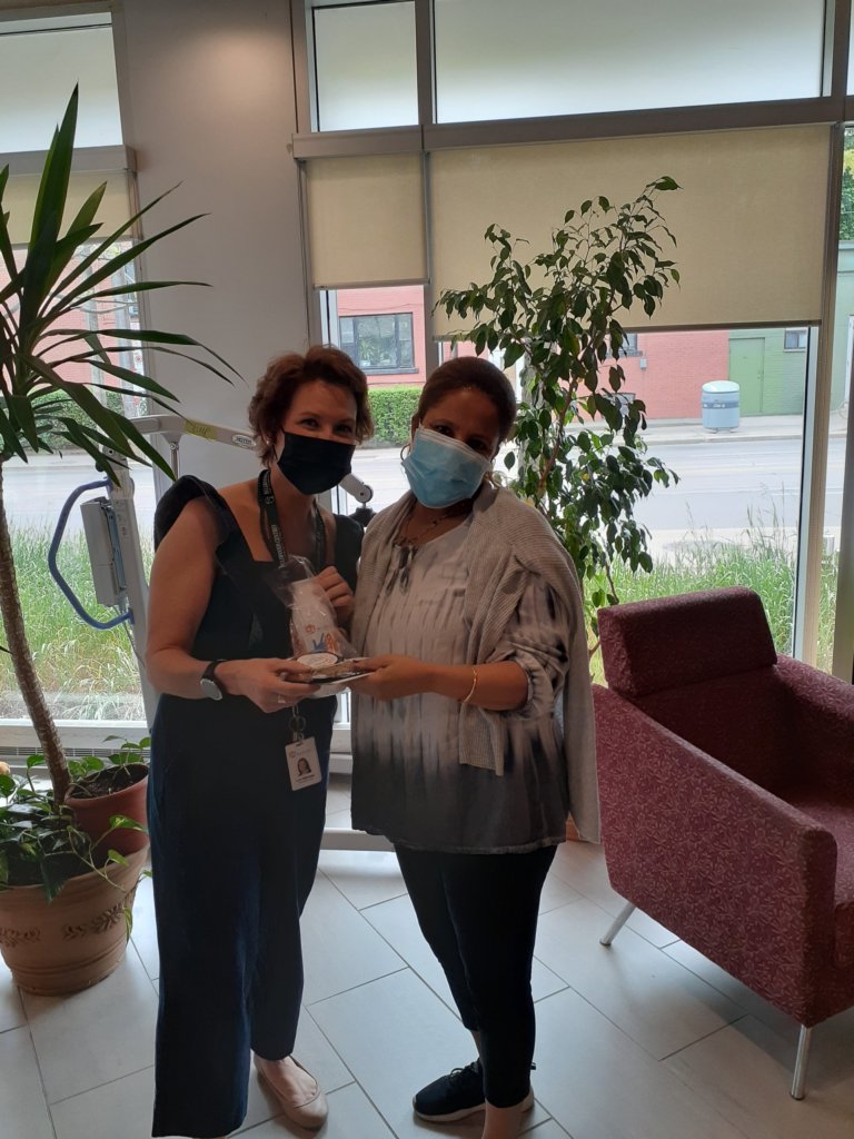 Lori Holloway, Bellwoods CEO presents a gift to Bellwoods staff