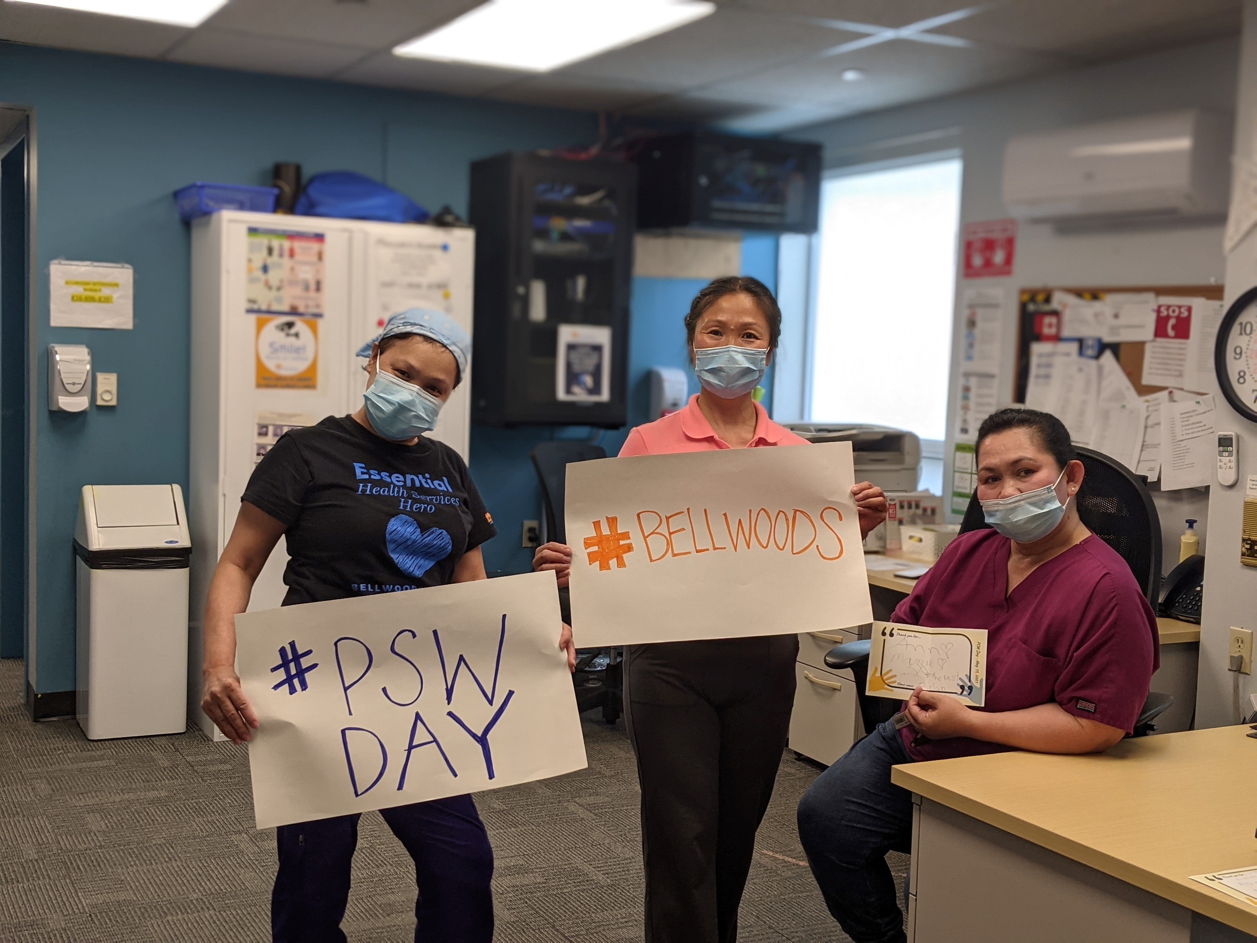 Bellwoods staff holding signs #Bellwoods and #PSW Day