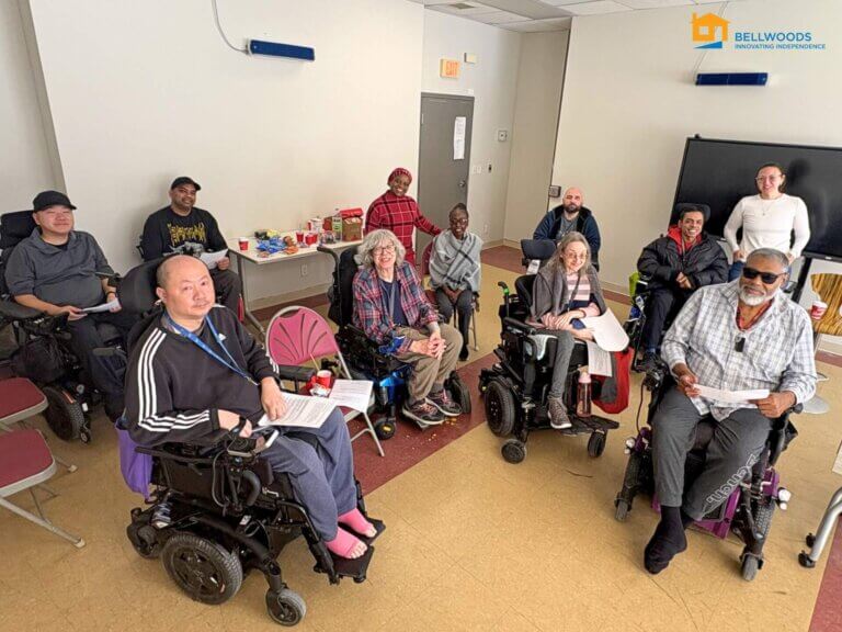People gathered in a shared space, participating in a Bellwoods Client Engagement Forum.